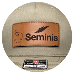 Tan Richardson 112 hat with brown leather patch engraved with Seminis logo and a pepper illustration.