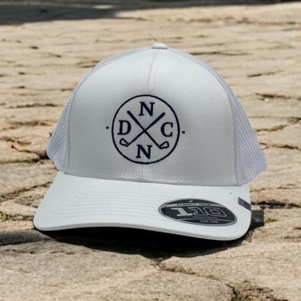 White mesh-back trucker cap featuring the DNC golf logo.