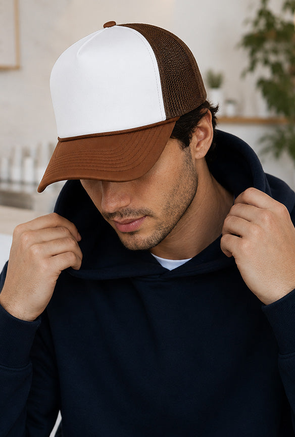 White and brown foam trucker hat with mesh back and curved bill, ideal for custom printing, logos and branded headwear.