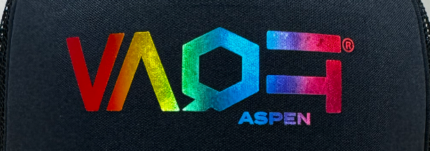 Close up of VAQE Aspen multicolor printed logo on the front panel of a black baseball cap