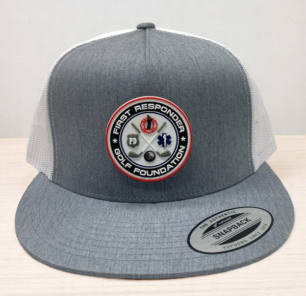 Gray and white trucker hat with First Responder Golf Foundation rubber patch