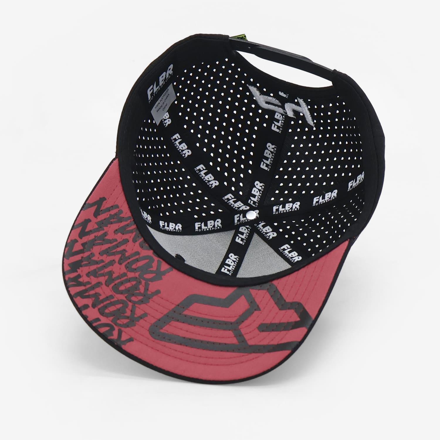 Inside of black cap showing perforated lining and red underbrim graphics.