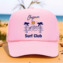 Pink 'Chapman Surf Club' cap with beach scene and palm trees.