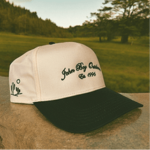 Beige and green 'John Big Cactus Est. 1996' cap with cactus design.