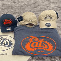 Caps and t-shirts with 'Eats' logo and beige caps.