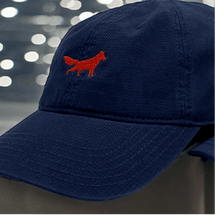 Navy cap with red fox logo.
