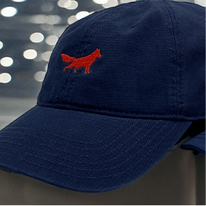 Navy cap with red fox logo.