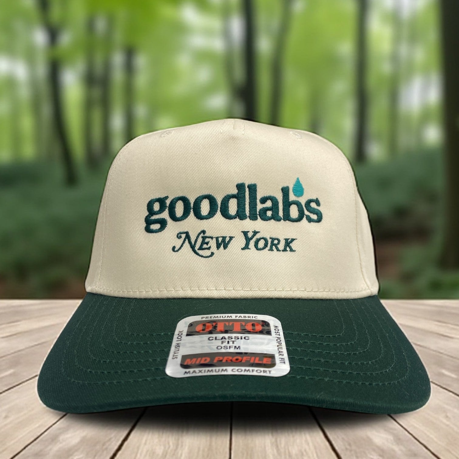 Two-tone green and white trucker hat with embroidered Goodlabs New York logo on the front panel.