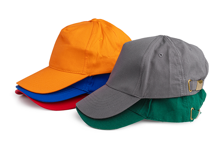 A stack of five baseball caps in different colors. The top hat is orange, followed by blue, then gray, and green at the bottom, on a white background.