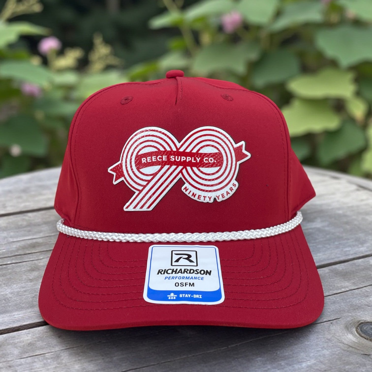 Red Richardson performance rope hat with Reece Supply Co. Ninety Years anniversary graphic on the front.